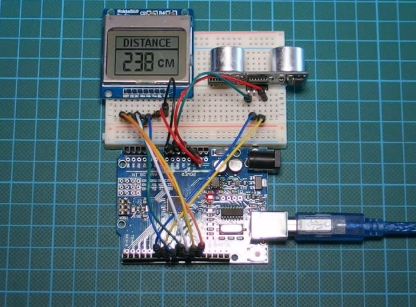 Arduino distance meter with Ultrasonic Sensor HC SR04 and Nokia 5110 LCD display