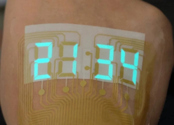 Stretchable electroluminescent stopwatch display sits like a tattoo on your skin